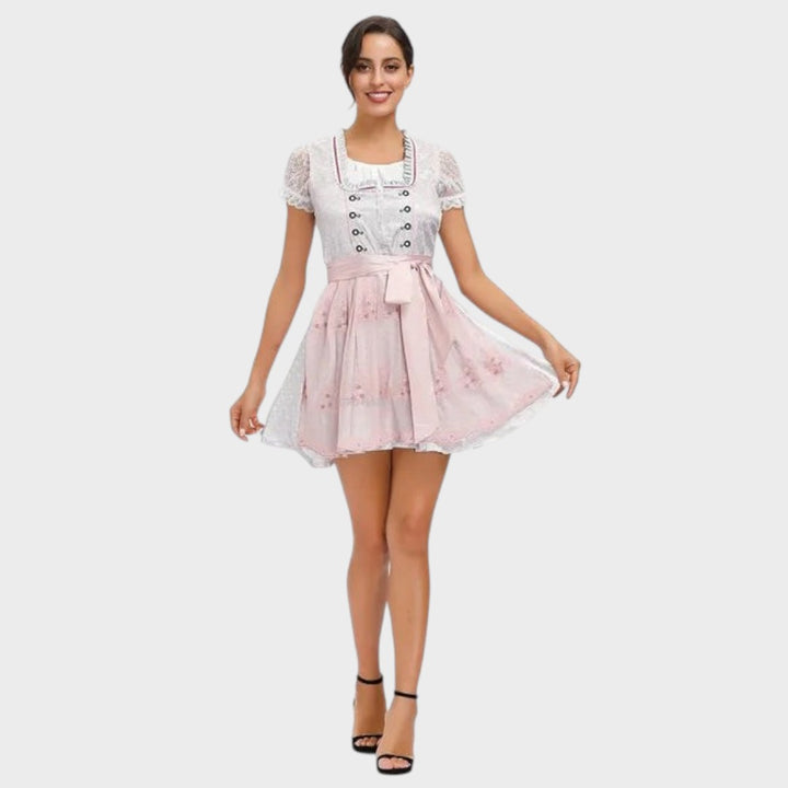Dirndl Lars Hamburg branco e rosa com detalhes em renda, mangas curtas e avental, ideal para o Oktoberfest.