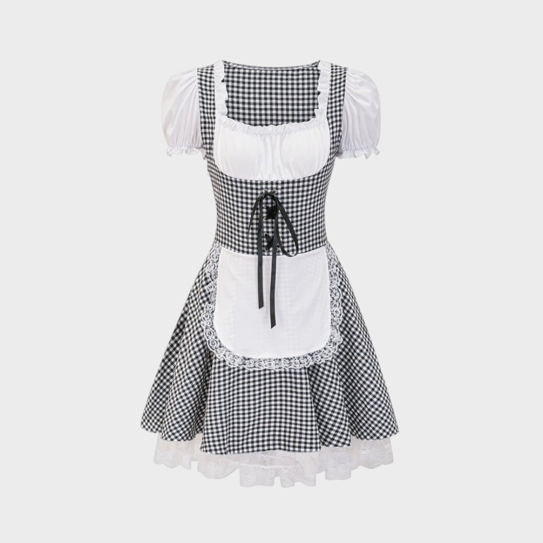 Dirndl Lars Hamburg Zita em xadrez preto e branco com avental branco, detalhes em renda e mangas bufantes.