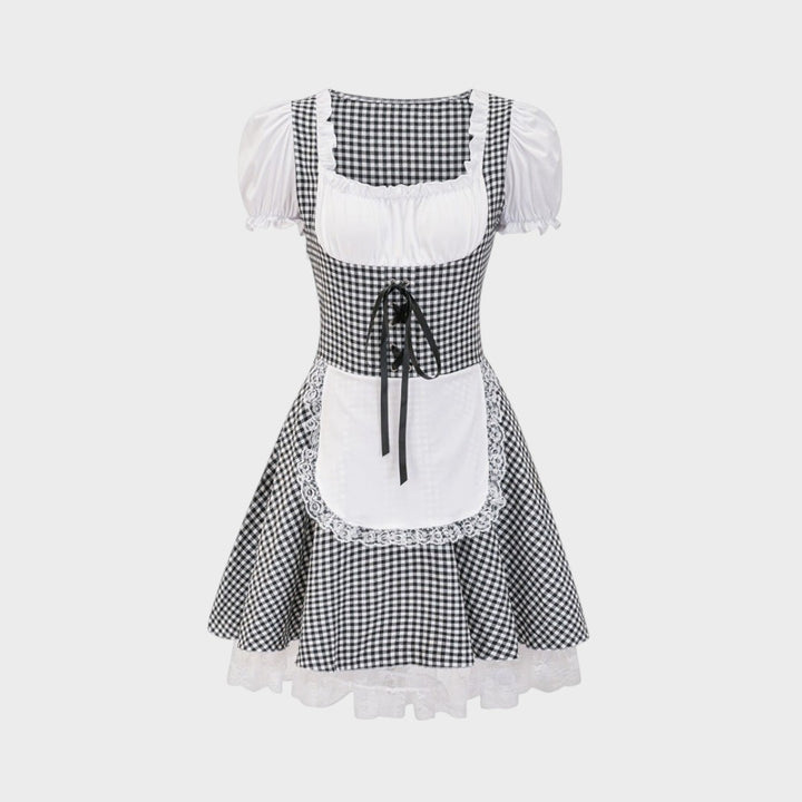 Dirndl Lars Hamburg Zita em xadrez preto e branco com avental branco, detalhes em renda e mangas bufantes.