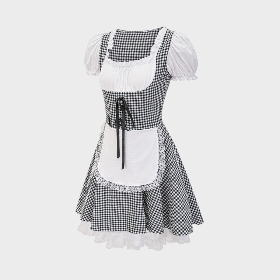 Dirndl Lars Hamburg preto e branco com padrão xadrez, avental branco, detalhes em renda e laço frontal para Oktoberfest.