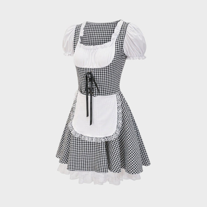 Dirndl Lars Hamburg preto e branco com padrão xadrez, avental branco, detalhes em renda e laço frontal para Oktoberfest.