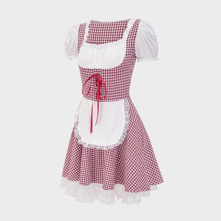 Dirndl Lars Hamburg Zita com padrão xadrez vermelho e branco, mangas curtas bufantes e avental com detalhes em renda.