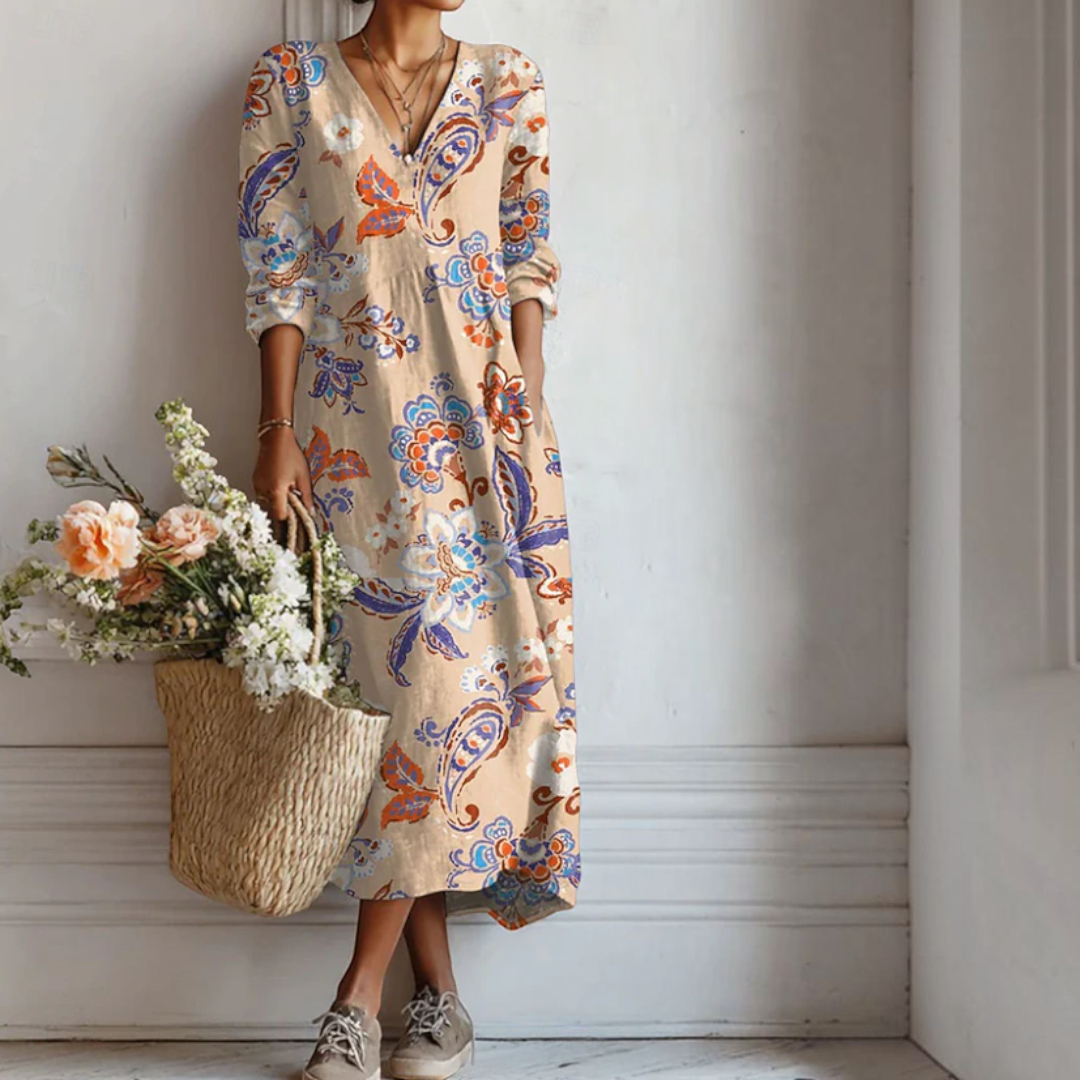 Vestido midi Lars Hamburg estilo boho com estampa floral paisley em tons de bege, laranja e azul, corte fluido.