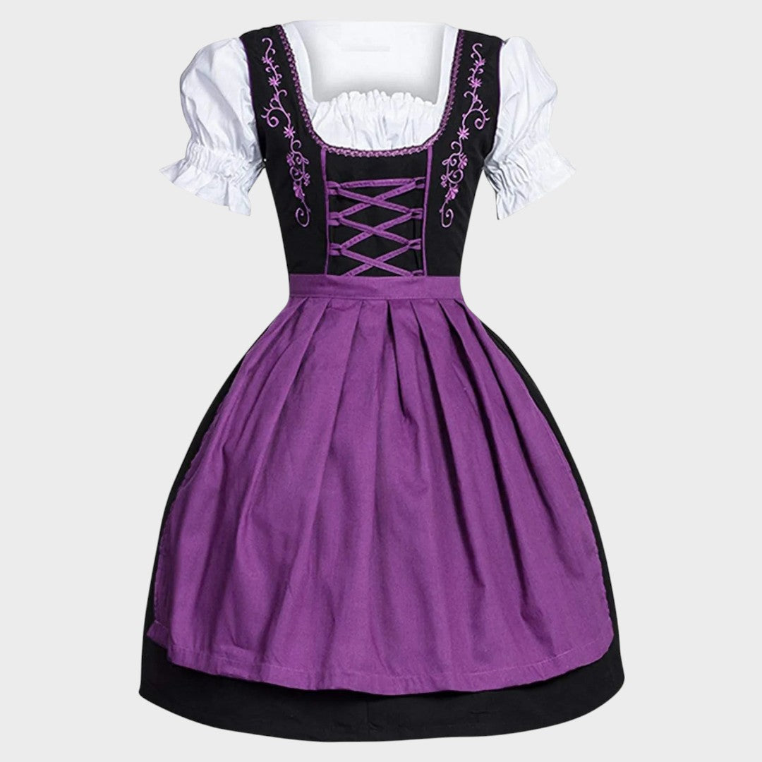 Vestido Dirndl Lars Hamburg para Oktoberfest em preto e roxo com blusa branca, bordados florais e laço frontal.