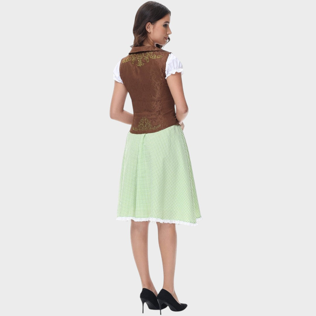 Modelo de costas usando vestido tradicional Lars Hamburg com corpete castanho bordado e saia verde xadrez com folhos.