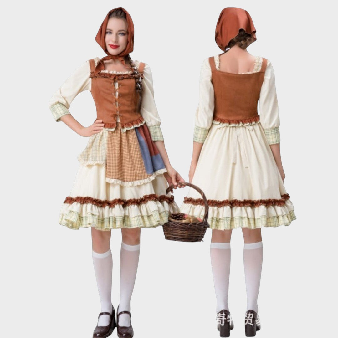 Modelo veste vestido tradicional Lars Hamburg Gundi com corpete castanho, saia de algodão e lenço de cabeça